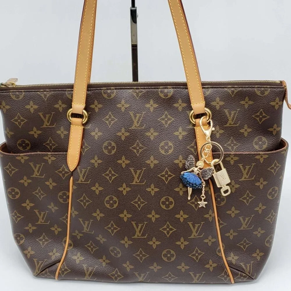 Authentic Louis Vuitton Lock & Key with unbranded Fairy Bagcharm, Keycharm